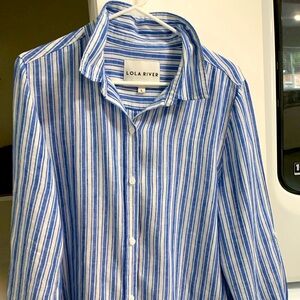 Button down blue and white women’s shirt.
